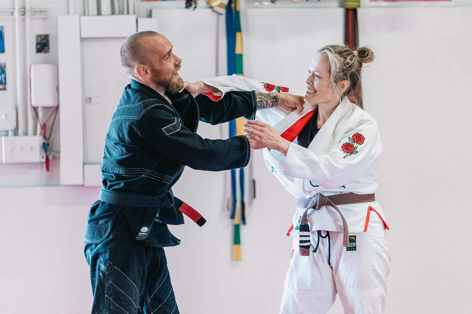 Students practicing BJJ techniques