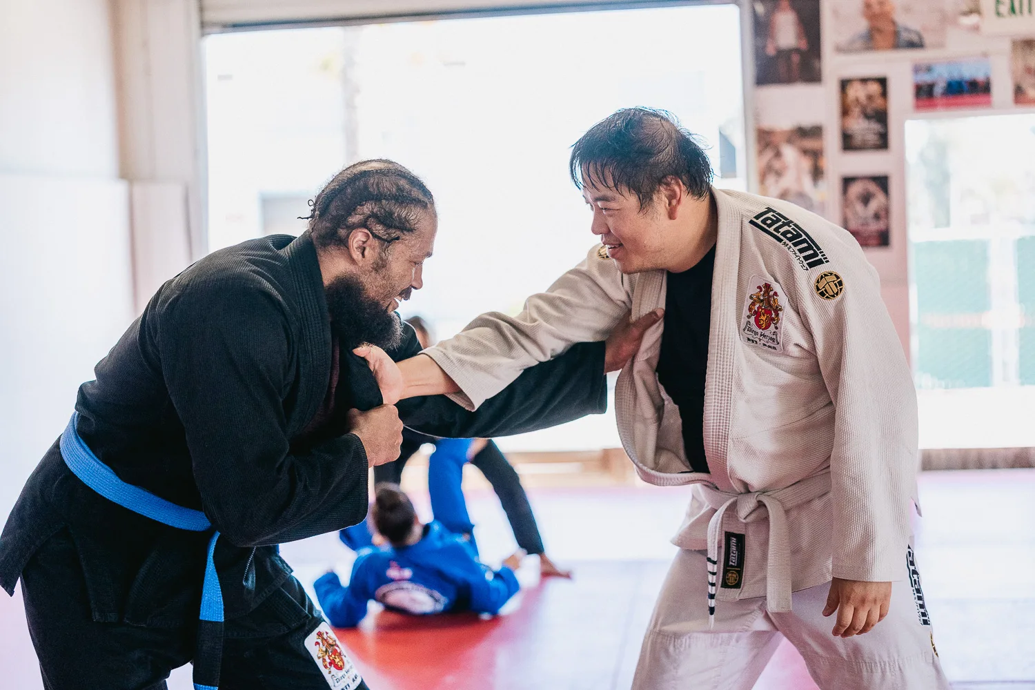 Students practicing BJJ techniques